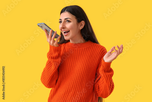 Young woman using mobile ph...