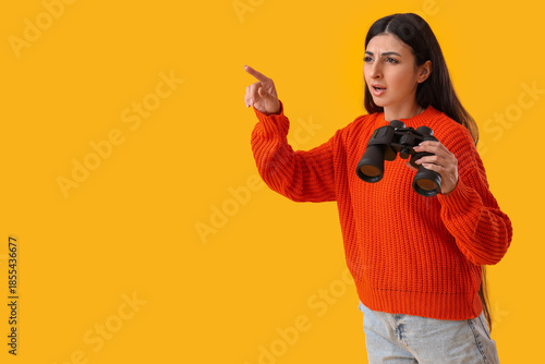 Young woman with binoculars...