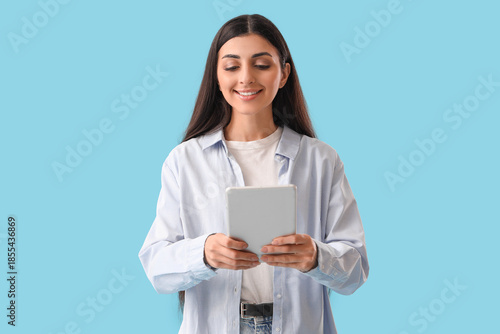 Young woman with tablet com...