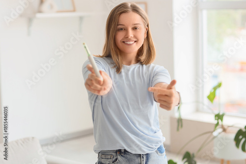 Young woman with syringe of...
