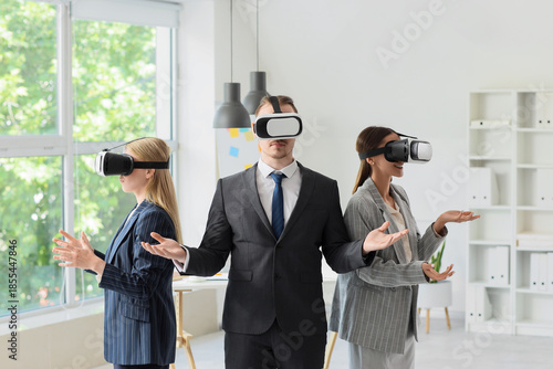 Business people using VR gl...