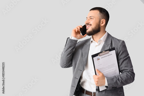 Male real estate agent with...