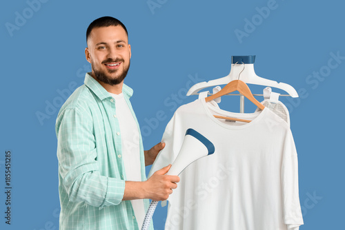 Young man steaming white t-...