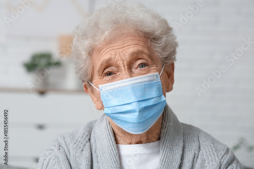 Elderly woman in medical ma...