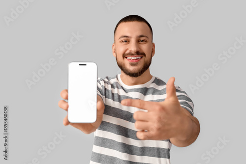 Handsome young man pointing...