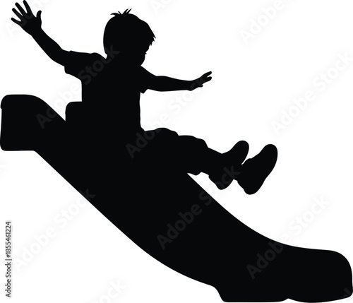 Silhouette of a joyful young boy sliding down a playground slide with arms raised high in excitement and fun