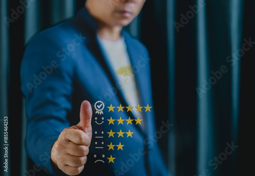 Person in blue suit gives thumbs up, symbolizing positive feedback and satisfaction. image features digital overlay of five star rating system, indicating high quality or approval