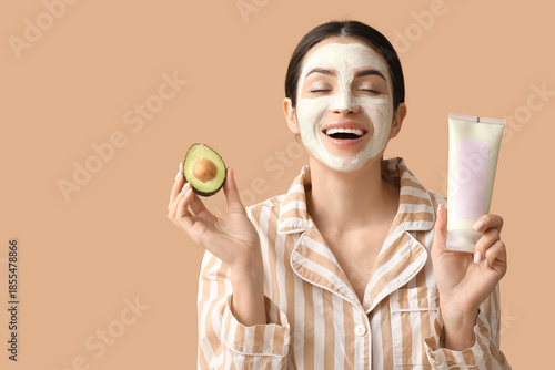 Happy young woman with tube...