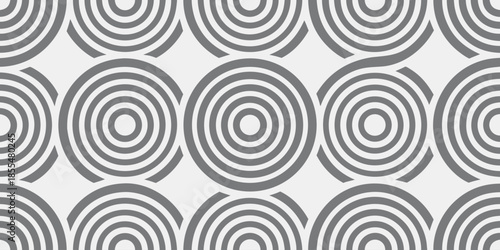 Grey concentric circles pattern on white background