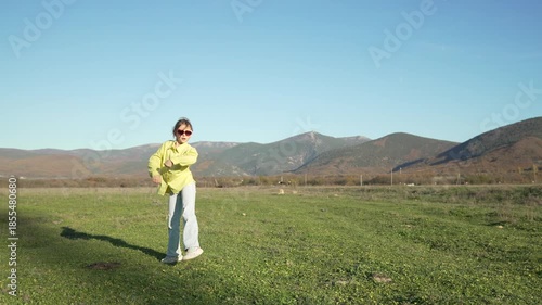 Joyful Energetic Girl Dancing Outdoor Enjoying Mountains and Nature.