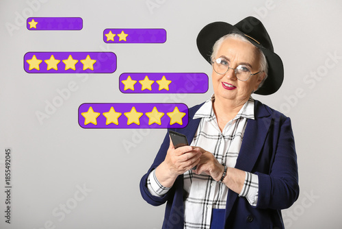 Stylish elderly woman with ...