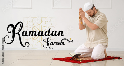 Young Muslim man with Koran...