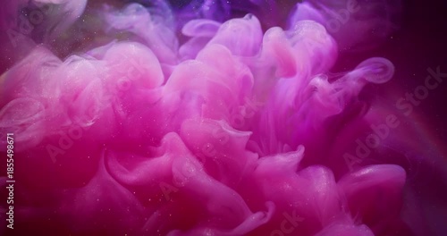 Fume water. Cloud vapor. Defocused pink purple color rainbow ink glitter swirling liquid floating on abstract acrylic art background.