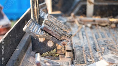 Close-up at gas pedal or throttle foot step of backhoe excavator vehicle. Industrial vehicle object part photo. Selective focus.