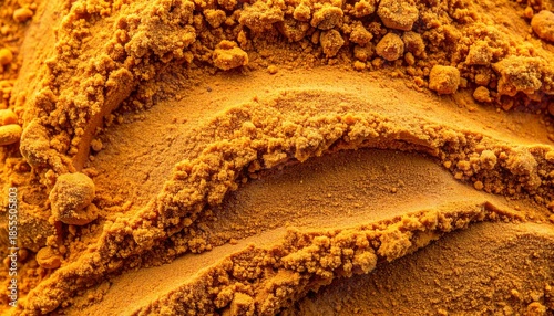 Wallpaper Mural Close-up of golden turmeric powder texture Torontodigital.ca