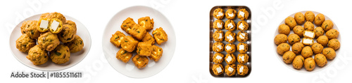 Four plates with fried food, some with cheese cubes, arranged on a plain surface in a studio shot on transparent background