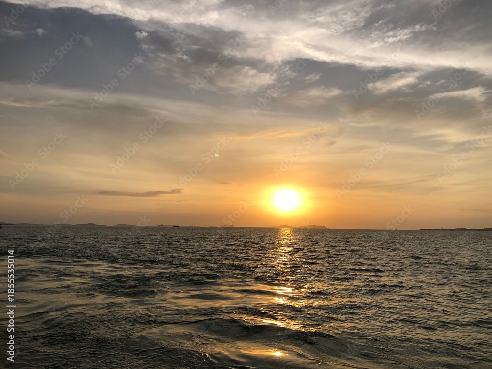 Fototapeta premium Vibrant sunset over calm ocean, retirement bliss, travel, idyllic