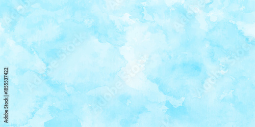 Abstract blue watercolor background featuring a soft cloudscape texture with white nature patterns of snow and ice under a bright summer sky