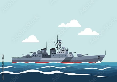 Gray warship with cannons sails on blue wavy water under clouds.