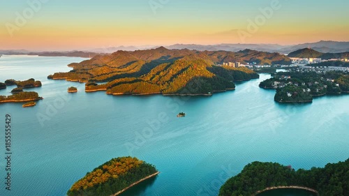 Wallpaper Mural Aerial shot of a large lake with lush green islands and mountain natural landscape at sunset in Hangzhou  Torontodigital.ca