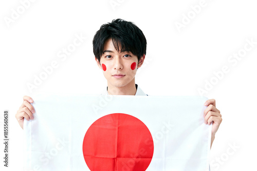 A proud individual waves the Japanese flag, his face adorned with painted red circles, embodying national pride and cultural heritage. The scene captures a sense of unity.
