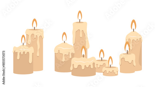 Group of lit cream colored candles with dripping wax and flickering flames