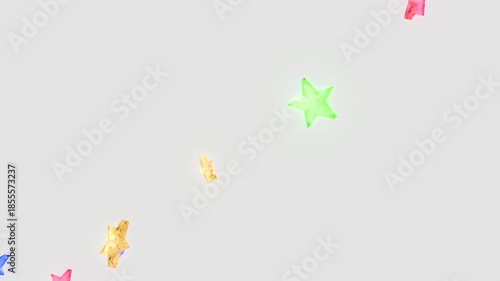 回転しながら落下するカラフルな星