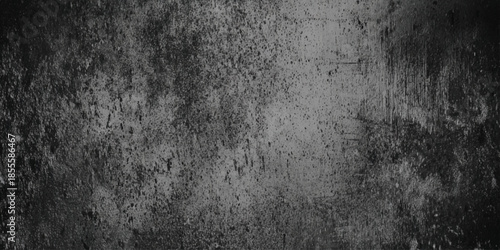 A heavily textured monochrome concrete wall exhibiting significant weathering and age providing a dark and gritty background