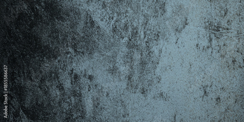 A textured dark teal and gray background displaying mottled patterns and subtle variations in tone and shade
