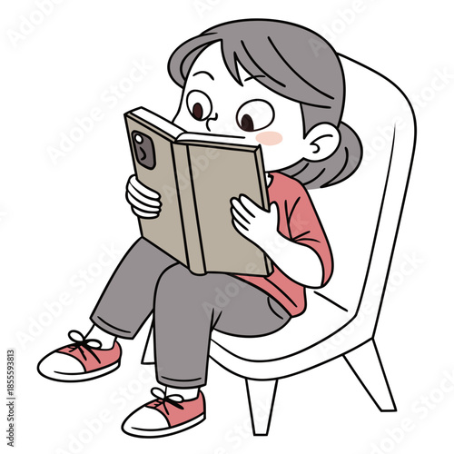 Girl sitting in chair holding book with phone inside