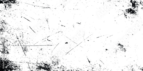 An abstract white texture with visible scratches smudges and dark specks resembling a distressed surface