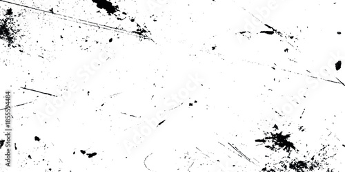 Abstract monochrome texture displaying scattered dark marks and linear streaks across a predominantly white background
