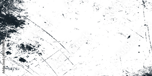 A stark abstract composition featuring dark smudges and linear scratches agepsnst a predominantly bright background