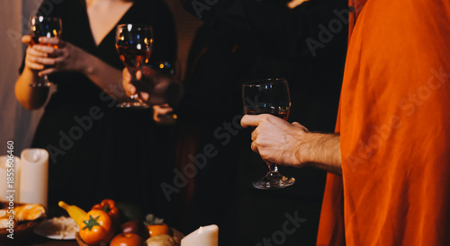 Friends enjoying a Halloween party at a bar making a toast