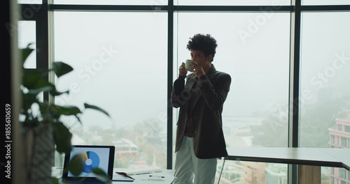 Entrepreneur analyses market trends from modern office environment