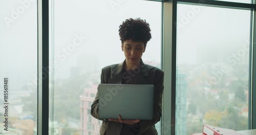 Urban designer reviews mockups and files in city office environment