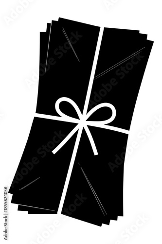 Stack of black envelopes tied with a white string bow isolated on white background