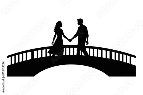 Silhouette of a couple holding hands walking across an arched bridge at sunset
