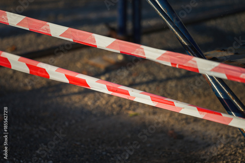 Tableau sur toile Red and white stripe barricade tape using to control danger zone in construction working site