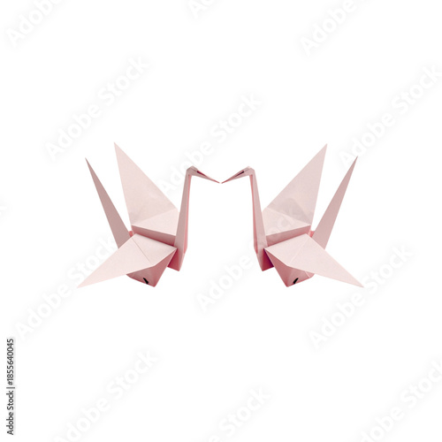 Delicate pink origami cranes on white background