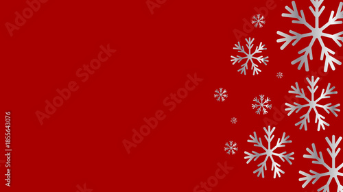 Elegant silver snowflakes gently descend upon a vibrant red background, perfect for festive winter holiday designs and greeting cards.
