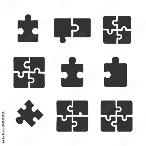 Set of nine puzzle piece icons in black and white.