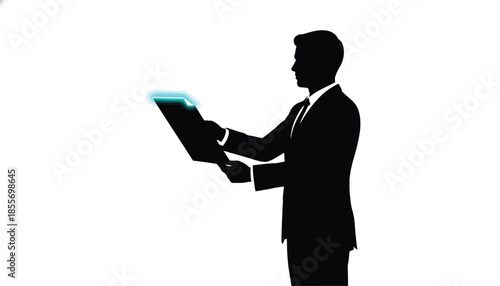 Businessman Holding Tablet in Silhouette