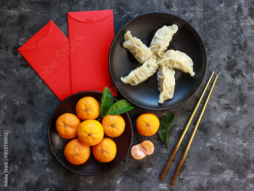 Auspicious foods during Chinese New Year include oranges and dumplings
