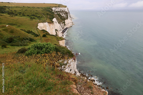 Landscape photo of the Dover chalk cliffs and the English Channel coastline right after the rain ends near Dover, United Kingdom	