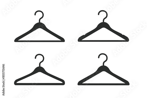 Four realistic black hangers on a dark gray background