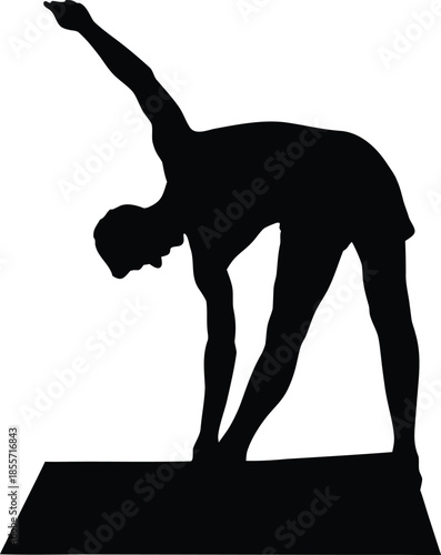 Silhouette of a person performing a side bend stretch on a yoga mat during fitness training