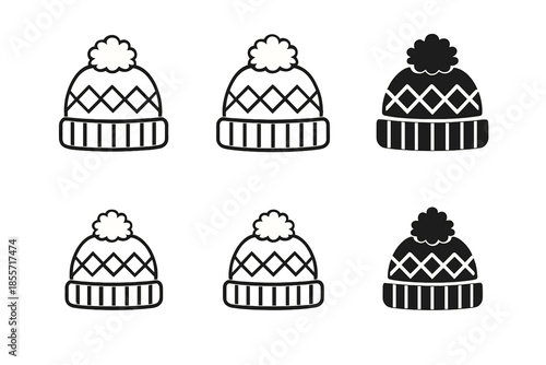 Set of six knitted winter hats with pom-poms on a textured background