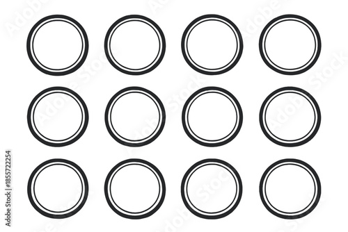 Grid of Twelve Dark Circles on Black Background