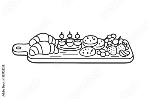 Assortment of Pastries and Fruits on a Cutting Board